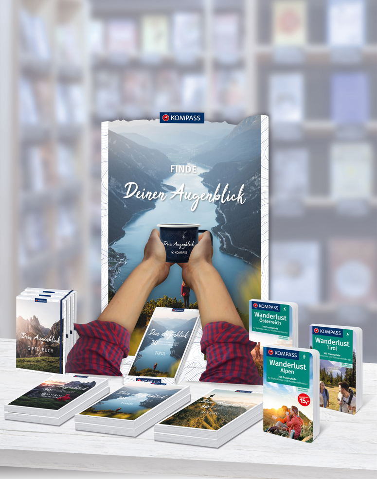 Ein Aufsteller, also Point of Sale, für den KOMPASS Verlag mit Büchern im Vordergrund.